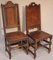 Two 18thC oak hall chairs.