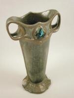 A late 19thC/early 20thC Bretby Art Nouveau style two handled vase