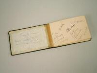 An autograph album containing a number of cricket players etc