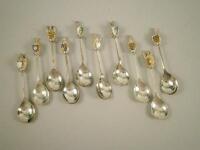 A set of nine silver commemorative spoons