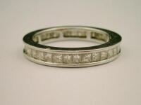 A diamond set full hoop eternity ring