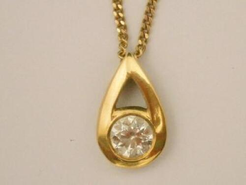 An 18ct gold pendant and chain