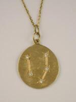 An 18ct gold Pisces pendant and chain