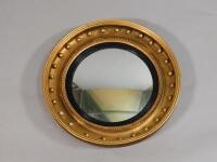 An early 19thC circular convex mirror