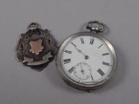 A pocket watch and crest fob