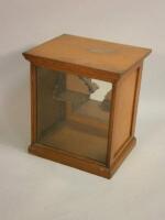 An early 20thC oak display cabinet