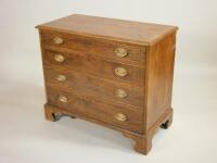 A George III mahogany chest of four long graduated drawers