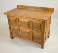 A panelled oak side cabinet