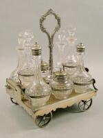 A Victorian cut glass and silver plated eight bottle cruet