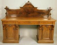 A Victorian figured mahogany pedestal sideboard