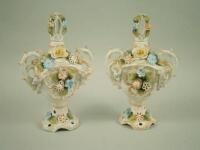 A pair of Dresden porcelain urns and covers