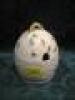 A Belleek honey pot, modelled as a beehive, painted with shamrocks and