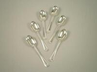 A set of six George V silver Old English pattern rat tail dessert spoons