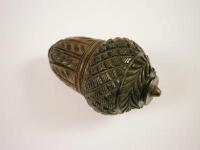 A 19thC carved walnut nutmeg grater in the form of an acorn