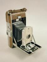 An early chrome plated aluminium and leather Polaroid land camera