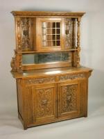 A late Victorian carved oak sideboard