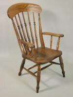 A 19thC Windsor type armchair with turned spindles