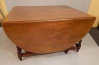 A large Victorian mahogany gate leg table