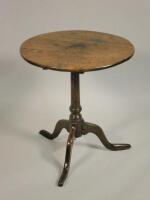 An early 19thC oak tilt top table