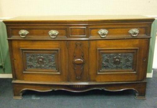 An early 20thC walnut bow front sideboard