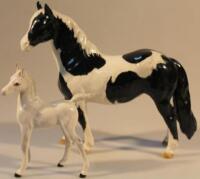 A Beswick model of a piebald horse and a Royal Doulton model foal