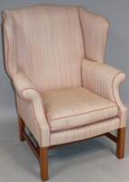 A Georgian style upholstered wingback chair