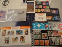 A collection of British commemorative stamps and world stamps.