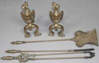 A set of three brass firing implements and a pair of andirons.