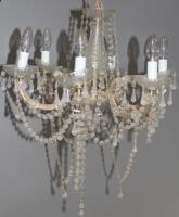 A pair of six branch glass chandeliers with pendent drops.