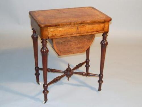 A Victorian walnut and mahogany sewing table