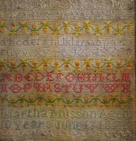 A Victorian framed needlework sampler