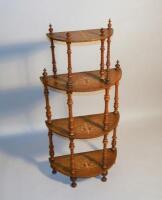 A Victorian walnut four tiered inlaid whatnot