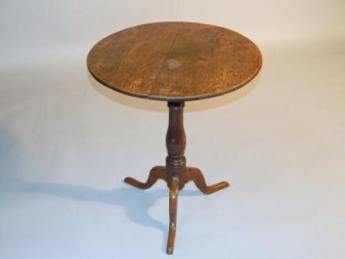 A Georgian oak circular wine table