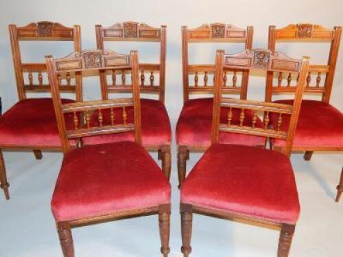 A set of six Edwardian oak dining chairs