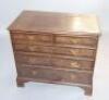 A Georgian mahogany crossbanded chest of drawers