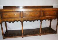 An 18th century style oak dresser base