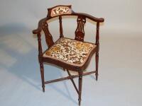 An Edwardian mahogany corner chair