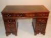 A mahogany leather topped twin pedestal desk.