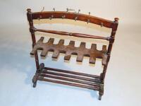 A Victorian mahogany boot and whip rack