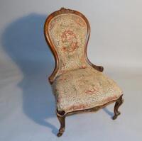 A Victorian upholstered spoonback nursing chair