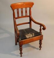 A Victorian pitch pine commode chair.