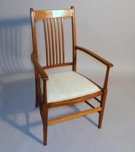 An Edwardian inlaid armchair