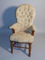 A Victorian walnut spoonback armchair