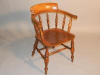 A Victorian oak smokers bow chair.