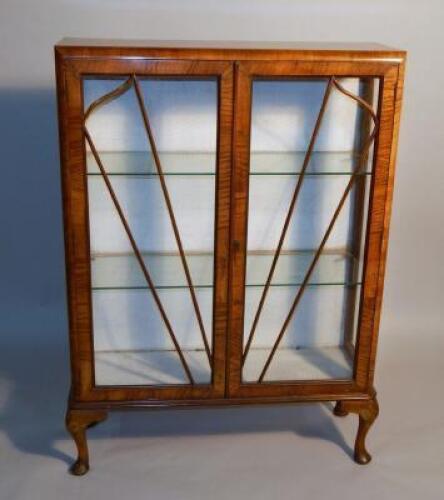 An Art Deco walnut glazed display cabinet