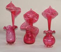 A selection of Jack in the Pulpit cranberry glass vases.