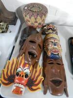 A tribal African style mask and an African style rattan pot with lid (2).