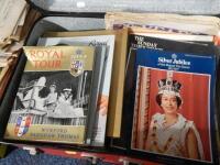 A suitcase of royalty related newspapers