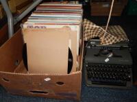 A Vintage Olympia manual typewriter and a selection of LP records.