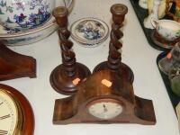 A 1930s mantel clock and a pair of barleytwist candlesticks.